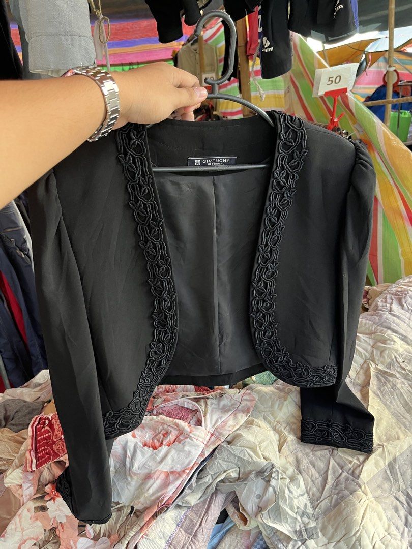 Givenchy Hi Formal Black Bolero Jacket Size 12 (Category: Coats, Jackets and Outerwear) located in Pilar. Submitted by fast-flip-ni-miko. (Listing ID 1468550811, Image 1). Description: - Brand: Givenchy Formal - Color: Black - Size: 12 - Material: 60% triacetate, 40% rayon blend (fully lined) - Design: Open front with braided trim along edges and cuffs - Cut: Short cropped with structured shoulders - Condition: Excellent pre-loved condition - Mod