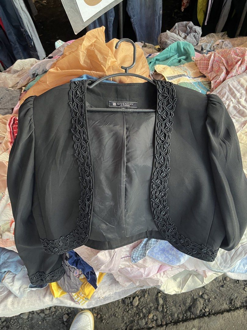 Givenchy Hi Formal Black Bolero Jacket Size 12 (Category: Coats, Jackets and Outerwear) located in Pilar. Submitted by fast-flip-ni-miko. (Listing ID 1468550811, Image 3). Description: - Brand: Givenchy Formal - Color: Black - Size: 12 - Material: 60% triacetate, 40% rayon blend (fully lined) - Design: Open front with braided trim along edges and cuffs - Cut: Short cropped with structured shoulders - Condition: Excellent pre-loved condition - Mod