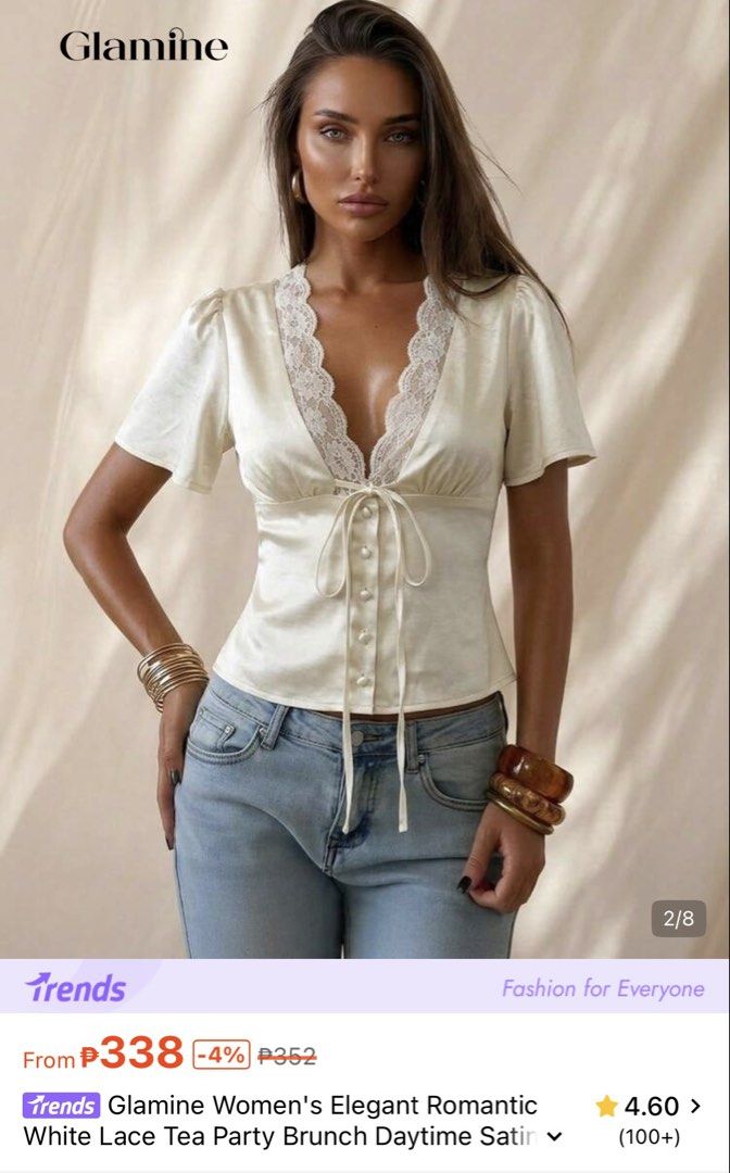 Glamine White Lace Satin Tie-Front Top (Category: Blouses) located in Manila. Submitted by joe_fashion1234 (Listing ID 1468584829, Image 2). Description: - Brand: Glamine - Color: Cream with white lace trim - Material: Lightweight satin with a slight sheen - Design: Deep V-neckline, front tie closure, decorative pearl-style buttons, and short puff sleeves - Versatile style: Ideal for daytime events, brunch, or casual outings - Easy to style: Look