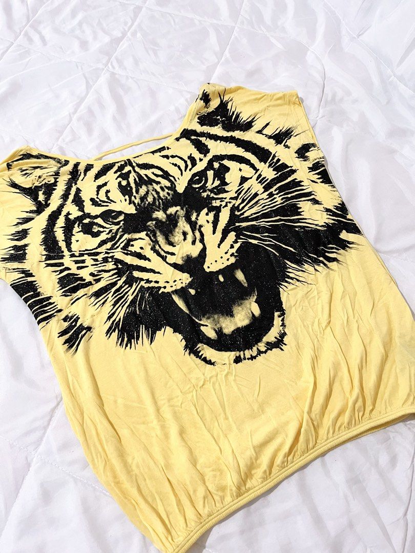 Glittery Tiger Y2K Graphic Yellow Top (Category: Others Tops) located in Naga. Submitted by itsrhoda (Listing ID 1468539374, Image 2). Description: 𝐓𝐇𝐈𝐑𝐓𝐘-𝐓𝐇𝐈𝐑𝐃 𝐂𝐎𝐋𝐋𝐄𝐂𝐓𝐈𝐎𝐍 🌞🌤️🪐✨ A series of y2k/vintage masterpieces you badly desire to add to your set of handpicked clothes. READ! ✨ Kindly send a message with your NAME, ADDRESS, and CONTACT NUMBER after claiming. ✨ Every item is washed. ✨ Manage your expectations, as these a