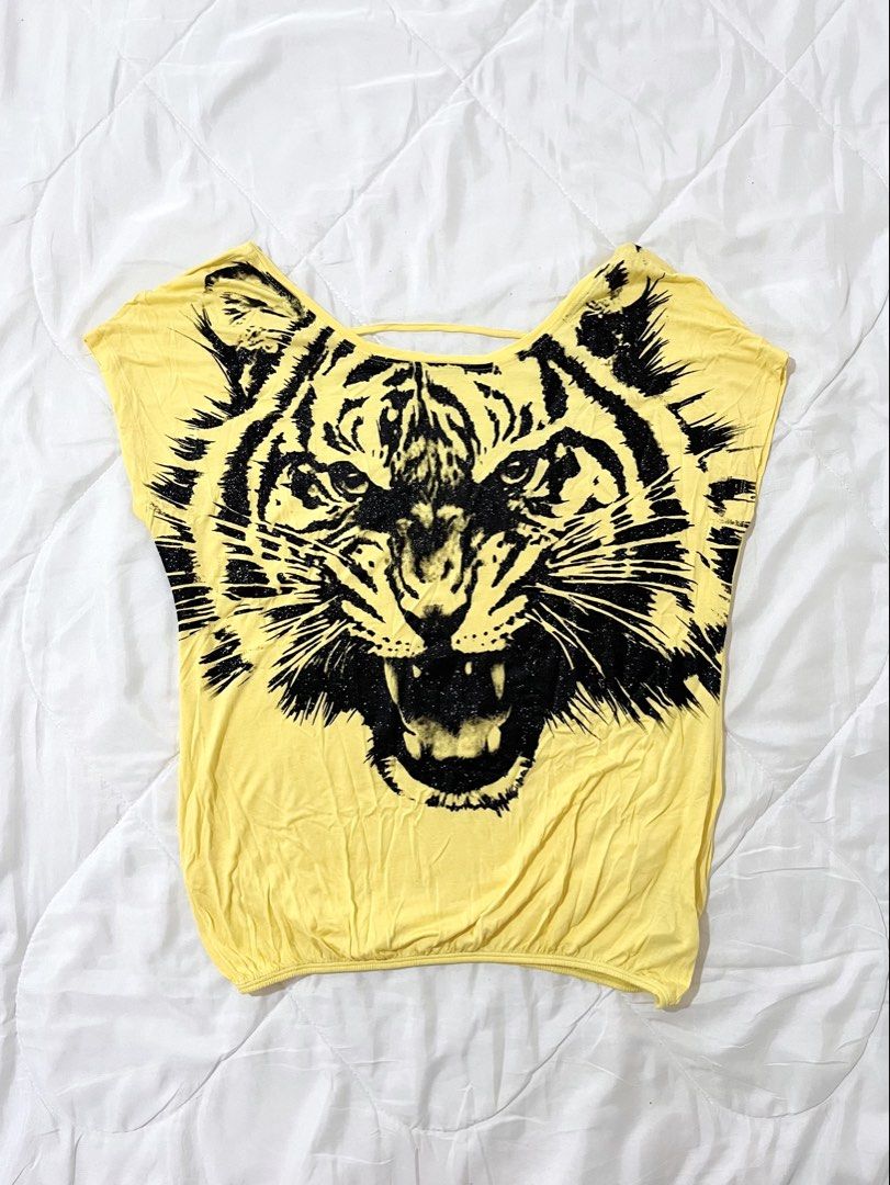 Glittery Tiger Y2K Graphic Yellow Top (Category: Others Tops) located in Naga. Submitted by itsrhoda (Listing ID 1468539374, Image 1). Description: 𝐓𝐇𝐈𝐑𝐓𝐘-𝐓𝐇𝐈𝐑𝐃 𝐂𝐎𝐋𝐋𝐄𝐂𝐓𝐈𝐎𝐍 🌞🌤️🪐✨ A series of y2k/vintage masterpieces you badly desire to add to your set of handpicked clothes. READ! ✨ Kindly send a message with your NAME, ADDRESS, and CONTACT NUMBER after claiming. ✨ Every item is washed. ✨ Manage your expectations, as these a