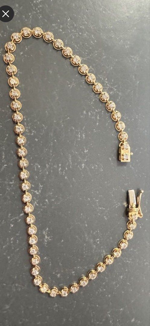 Gold Diamond Tennis Bracelet (Category: Bracelets) located in Mabalacat. Submitted by trinidadja95635 (Listing ID 1468636942, Image 2). Description: - Elegant gold tennis bracelet featuring sparkling round stones - Secure box clasp closure with safety latch for peace of mind - Classic design that catches the light beautifully - Lightly worn a few times and in very good overall condition - Perfect timeless accessory for everyday wear or special oc