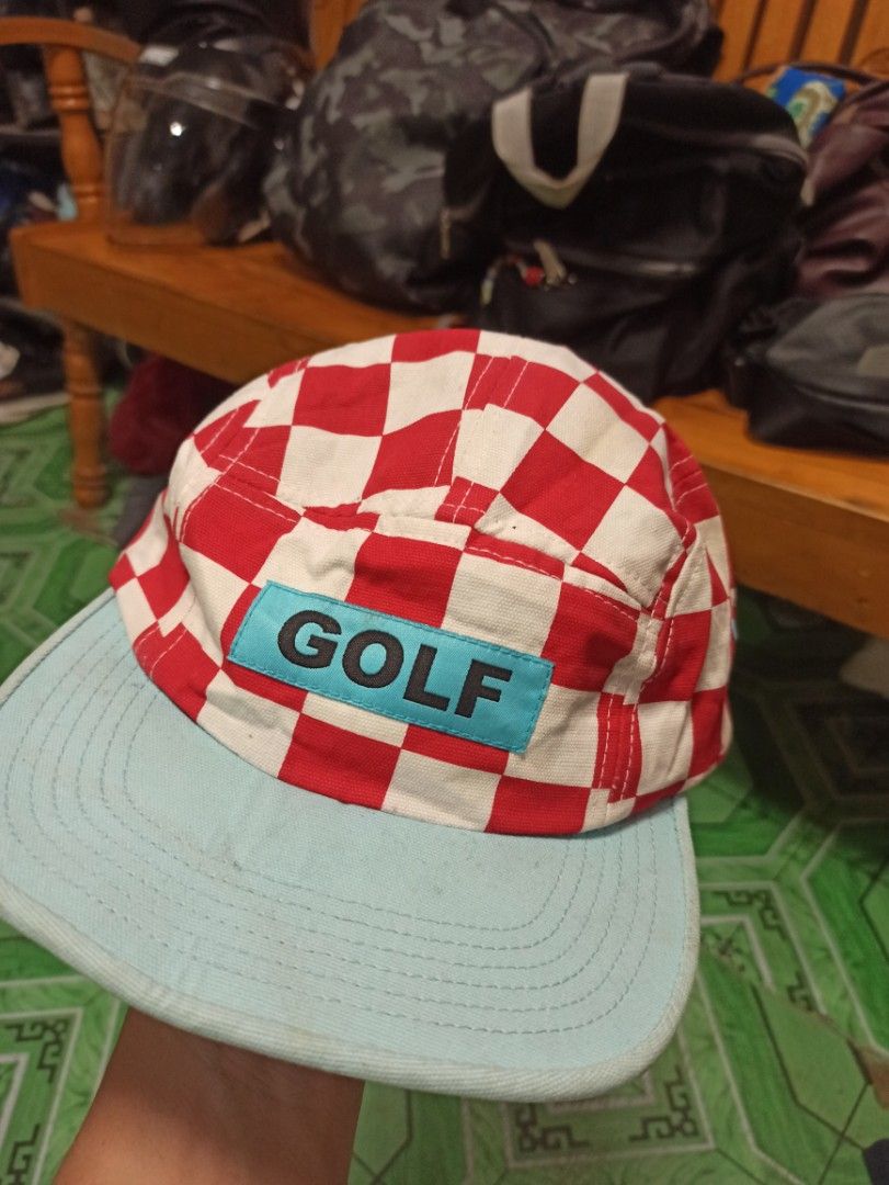 GOLF Wang Red and White Checkerboard Hat with Light Blue Brim (Category: Caps & Hats) located in Tagbilaran City. Submitted by delasierra39181 (Listing ID 1468586728, Image 1). Description: - Brand: GOLF Wang - Design: Red and white checkerboard pattern with light blue brim - Details: Contrasting rectangular GOLF logo patch on front - Back: Adjustable black strap with yellow GOLF tag - Origin: Made in USA (interior flag label) - Condition: Minor 