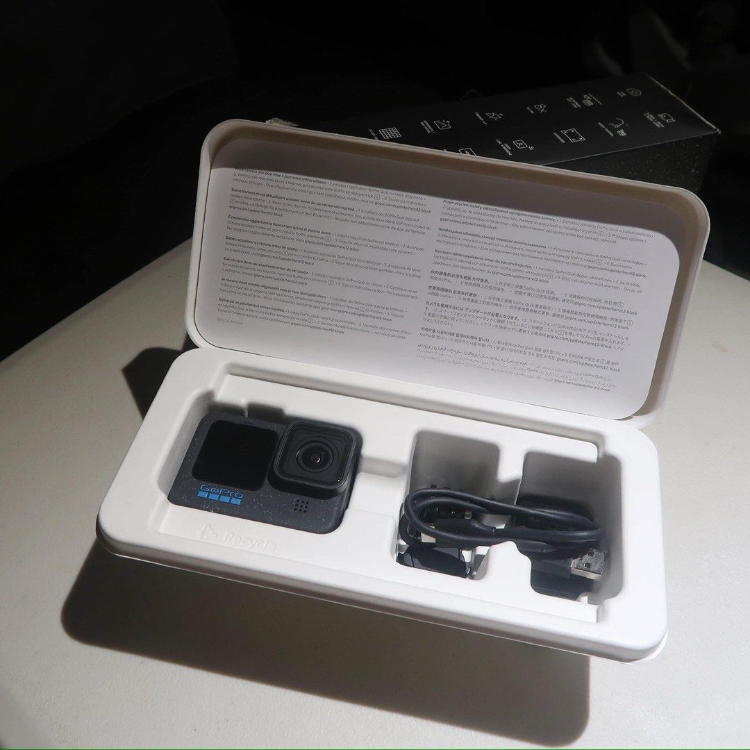 GoPro Hero12 Black with Accessories and Box (Category: Video Cameras) located in Manila. Submitted by maira_lucero (Listing ID 1468662969, Image 3). Description: - Item: GoPro Hero12 Black Action Camera - Condition: Excellent, ready for use - Included: Original box and USB-C charging cable - Accessories: Protective housing frame, yellow floating handle grip - Mounts: Several mounting buckles, thumbscrews, and an angled mount piece - Ideal For: Tr