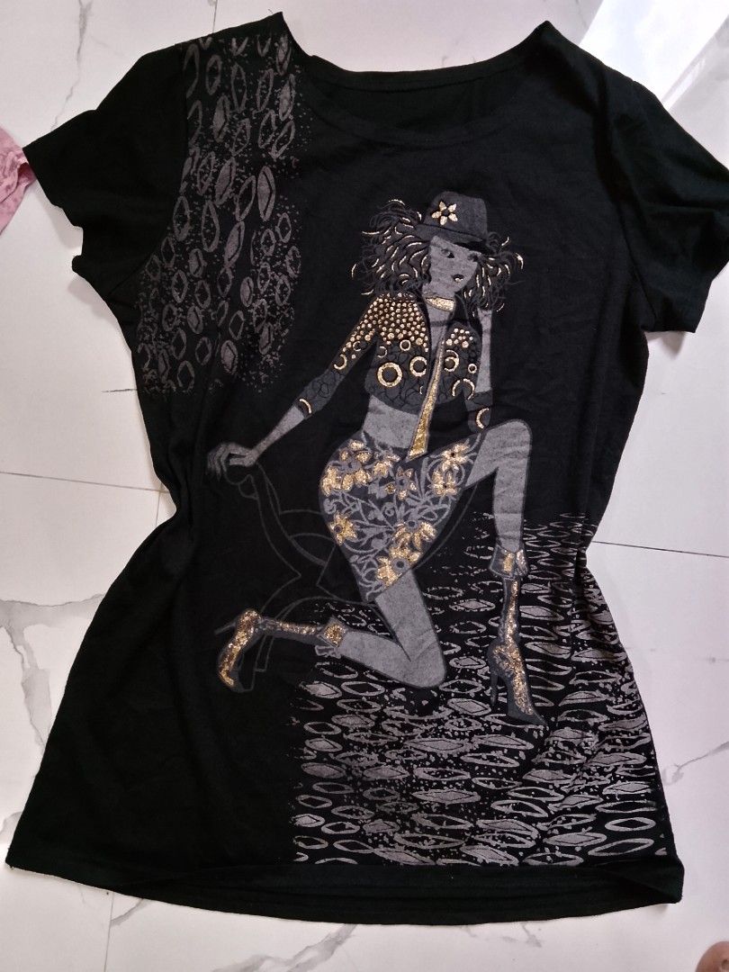 Graphic Print T-Shirt Bundle - Pink and Black (Category: Shirts) located in Manila. Submitted by keencrystal.595c28 (Listing ID 1468620149, Image 3). Description: - 2-in-1 graphic t-shirt bundle for one affordable price - Pink tee features a rhinestone-embellished vintage lady and cheetah print - Black tee features a fashion illustration with sparkly gold glitter accents - Classic crew neck and short sleeves - Made with soft, comfortable cotton f