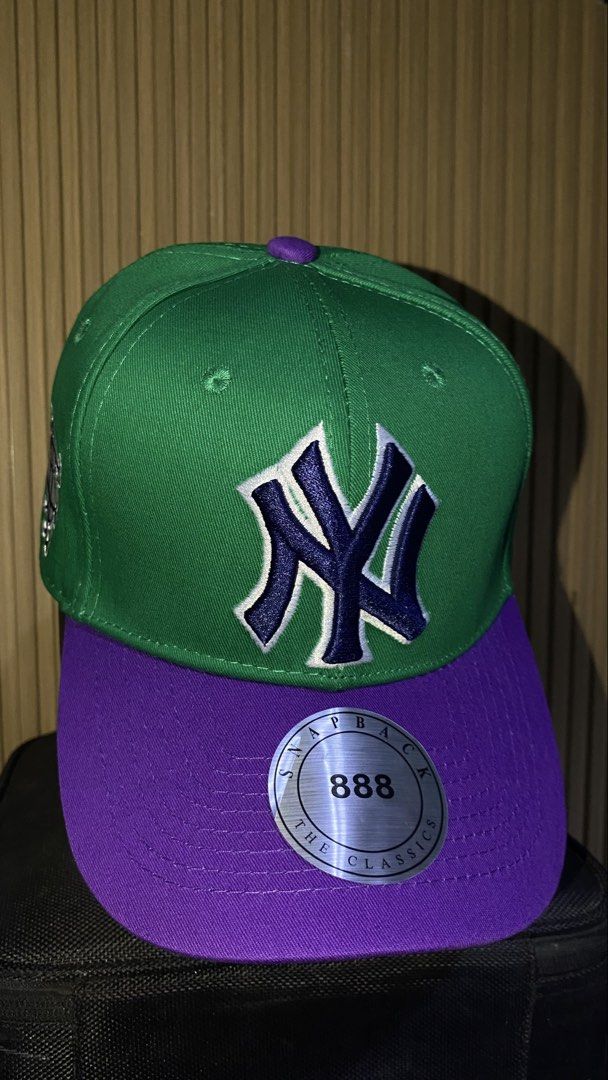 Green and Purple Yankees Snapback Hat (Category: Caps & Hats) located in Manila. Submitted by _kyndzgrt (Listing ID 1468682497, Image 1). Description: - Color: Green and Purple - Team: NY Yankees embroidered logo on front with dark blue and white outline - Details: Extra side panel embroidery and flat brim with original metallic sticker - Fit: Adjustable snap closure at the back - Condition: Excellent/New.