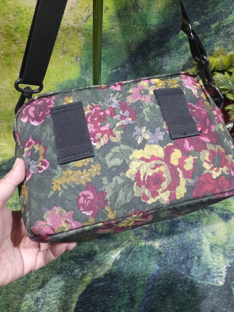 Gregory Floral Shoulder Bag (Category: Sling Bags) located in Baguio. Submitted by klayblakeb87803 (Listing ID 1468594141, Image 3). Description: - Brand: Gregory - Design: Vibrant floral print on dark green background - Materials: 100% polyester exterior, 100% nylon interior - Strap: Adjustable black shoulder strap - Pockets: Main zippered compartment, front zip pocket, and interior organizational slip pockets - Origin: Made in the Philippines -