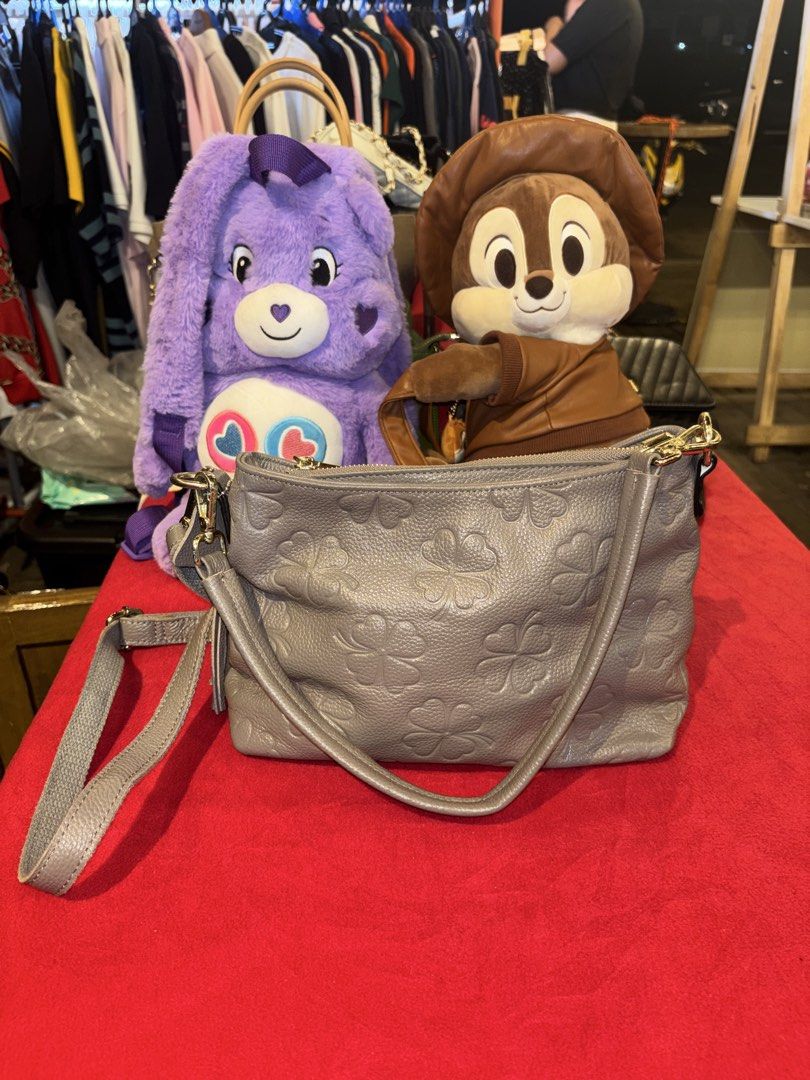 Grey clover patterned leather shoulder bag with tassel (Category: Shoulder Bags) located in Manila. Submitted by jeromskito66462 (Listing ID 1468674003, Image 1). Description: - Grey pebbled leather with debossed clover pattern - Includes a matching short strap and an adjustable crossbody strap - Features elegant gold-tone hardware and a stylish tassel zipper pull on the back pocket - Fabric-lined interior equipped with secure zipped compartments