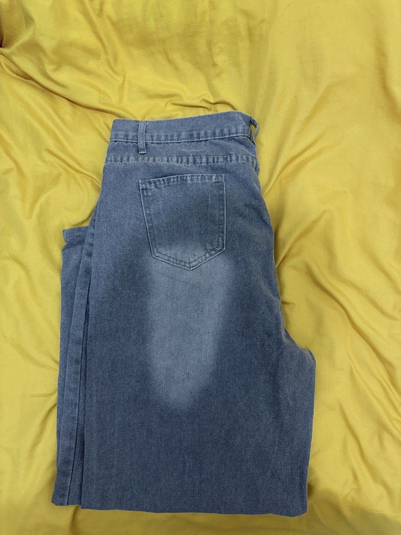 Grey Distressed Denim Jeans (Category: Jeans) located in Muntinlupa City. Submitted by closetfinds_ph_952 (Listing ID 1468688091, Image 3). Description: - Size: 2XL - Color/Wash: Grey denim with front whisker fading - Fit: Casual straight leg - Closure: Standard button and zipper fly - Features: Functional back pockets - Condition: Clean fabric overall.