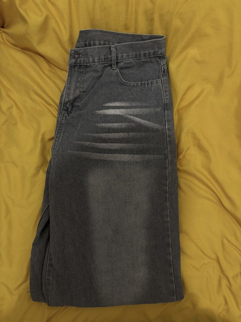 Grey Distressed Denim Jeans (Category: Jeans) located in Muntinlupa City. Submitted by closetfinds_ph_952 (Listing ID 1468688091, Image 2). Description: - Size: 2XL - Color/Wash: Grey denim with front whisker fading - Fit: Casual straight leg - Closure: Standard button and zipper fly - Features: Functional back pockets - Condition: Clean fabric overall.