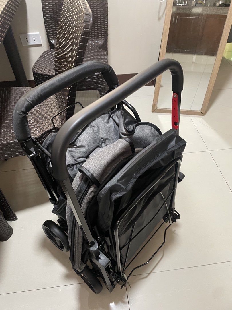 Grey foldable baby stroller pushchair (Category: Strollers) located in Caloocan City. Submitted by anjpot (Listing ID 1468563022, Image 2). Description: - Color: Sleek grey with a sturdy black metal frame - Comfort: Padded seat with adjustable harness straps for safety - Design: Double handlebar setup and protective canopy - Portability: Folds down compact for easy storage and travel - Ideal for: Infants and toddlers, perfect for daily use.