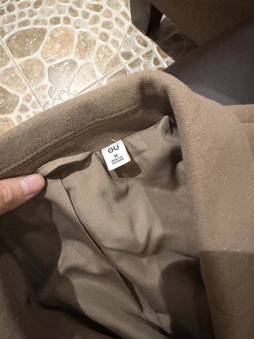 GU Brown Long Wool Coat Size M (Category: Coats, Jackets and Outerwear) located in Quezon City. Submitted by kimioutlet (Listing ID 1468607438, Image 3). Description: - Brand: GU - Color: Brown - Size: Medium (Made in Vietnam) - Condition: Worn once in Tokyo, like new and super clean - Features: Lapel collar, long sleeves, 2 black front buttons, extra warm - Length: Hits past the knees RFS: Not using anymore Bought in GU Japan.