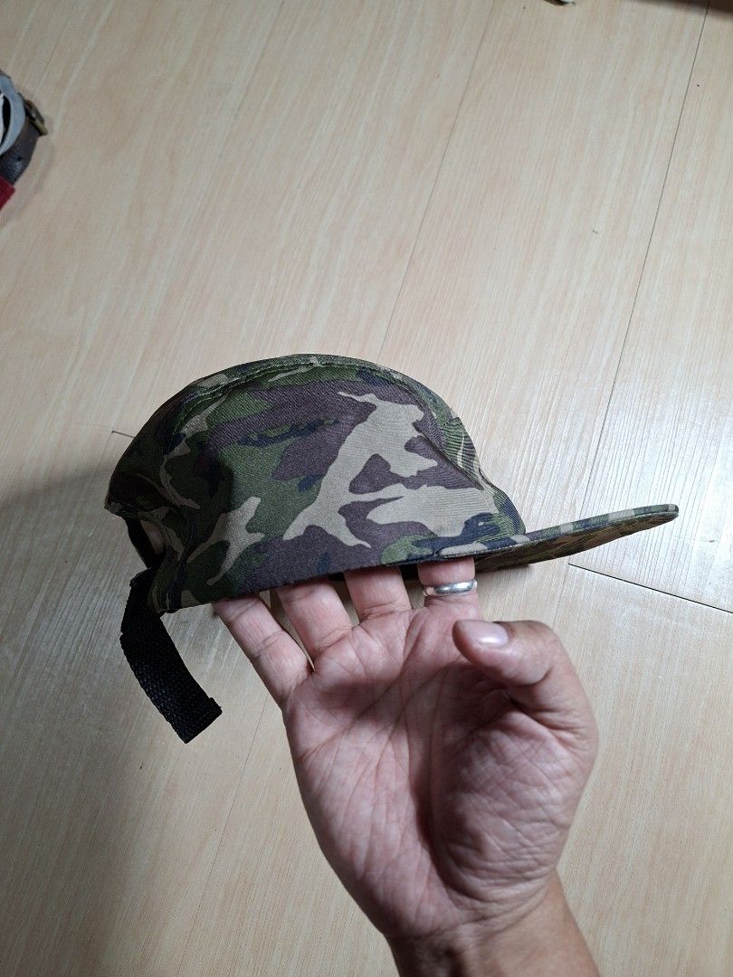 GU Camouflage Cordura Camp Cap (Category: Caps & Hats) located in Baguio. Submitted by restyrille77846 (Listing ID 1468642837, Image 3). Description: - Brand: GU - Design: Green camouflage pattern - Material: Durable Cordura fabric - Style: Flat brim - Closure: Adjustable black strap with plastic buckle - Condition: Clean inside and out, ready to wear.