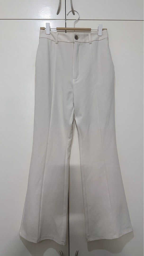 GU Flare Slacks (Category: Jeans) located in Bacolod City. Submitted by pym_shops (Listing ID 1468622797, Image 3). Description: - Brand/Item: GU flare pants - Color: Cream / Off-white - Size: Medium (M) - Fit: High waist with button closure and front center seams - Fabric: Structured with a slight stretch - Condition: Clean, ready to wear - Versatile: Great basic piece for work or casual outings.