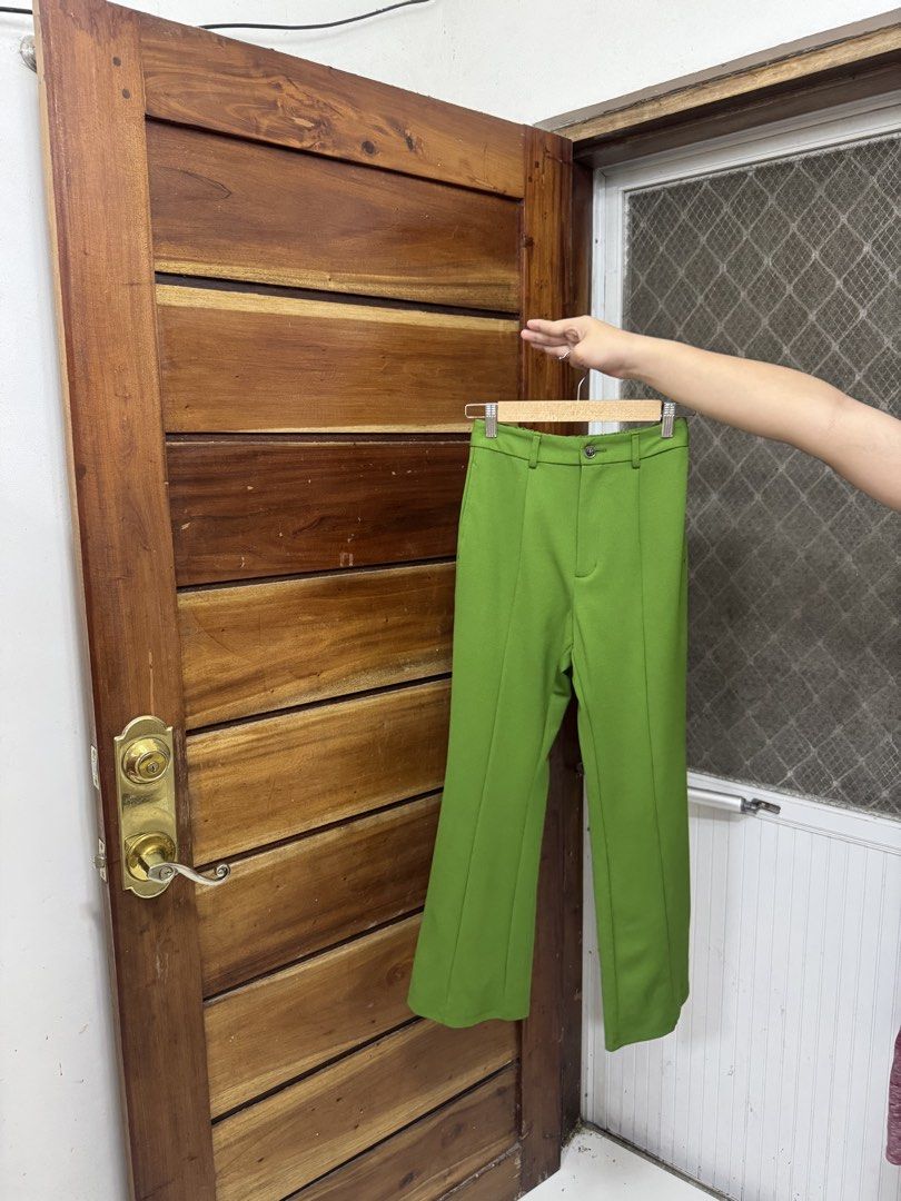 GU Green Wide Leg Pants Size S (Category: Jeans) located in Cavite. Submitted by yakultjeni85475 (Listing ID 1468654110, Image 3). Description: - Brand: GU - Color: Vibrant Green - Size: S (Tag attached) - Fit: High-waisted, wide leg - Details: Front pleats, belt loops, comfortable elastic back waistband - Material: Lightweight and smooth - Styling: Perfect for both casual outings and office wear.