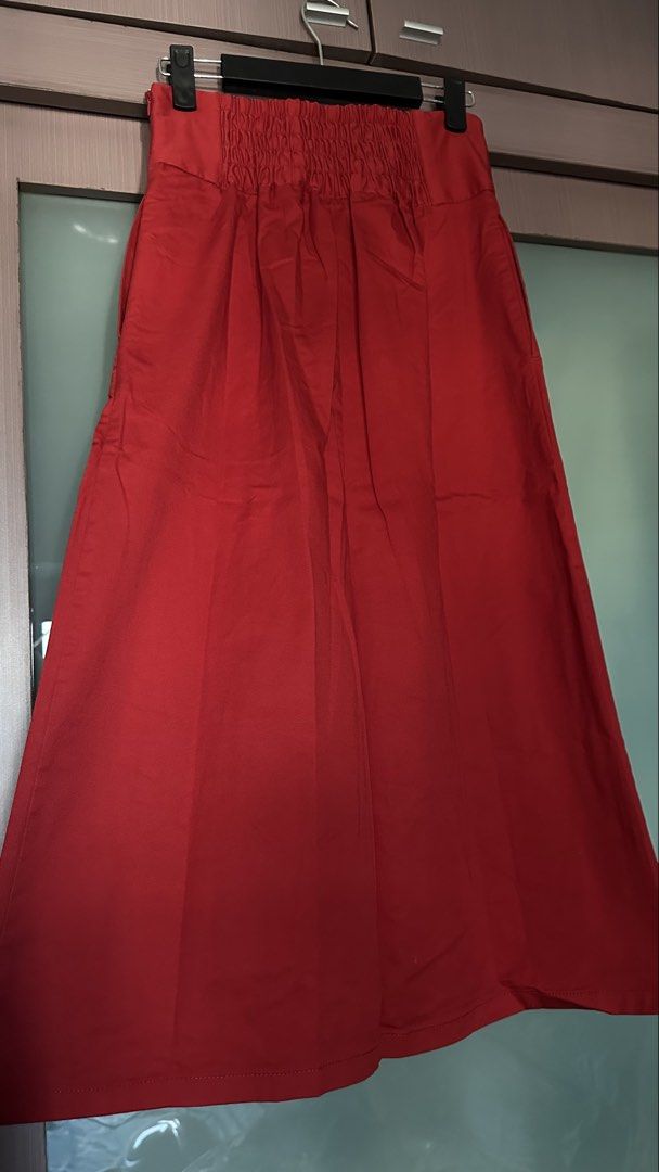 GU Red Long Skirt Size S (Category: Skirts) located in Mandaluyong City. Submitted by TheWeekendProject (Listing ID 1468575439, Image 3). Description: - Brand: GU - Condition: Like New - Size: S - Color: Red - Material: Cotton blend (73% cotton, 24% polyester, 3% polyurethane) - Design: High waist with elastic back paneling and side zipper closure - Features: Pleated front details and functional side pockets - Waist - 33 up to 36cm - Length - 82c