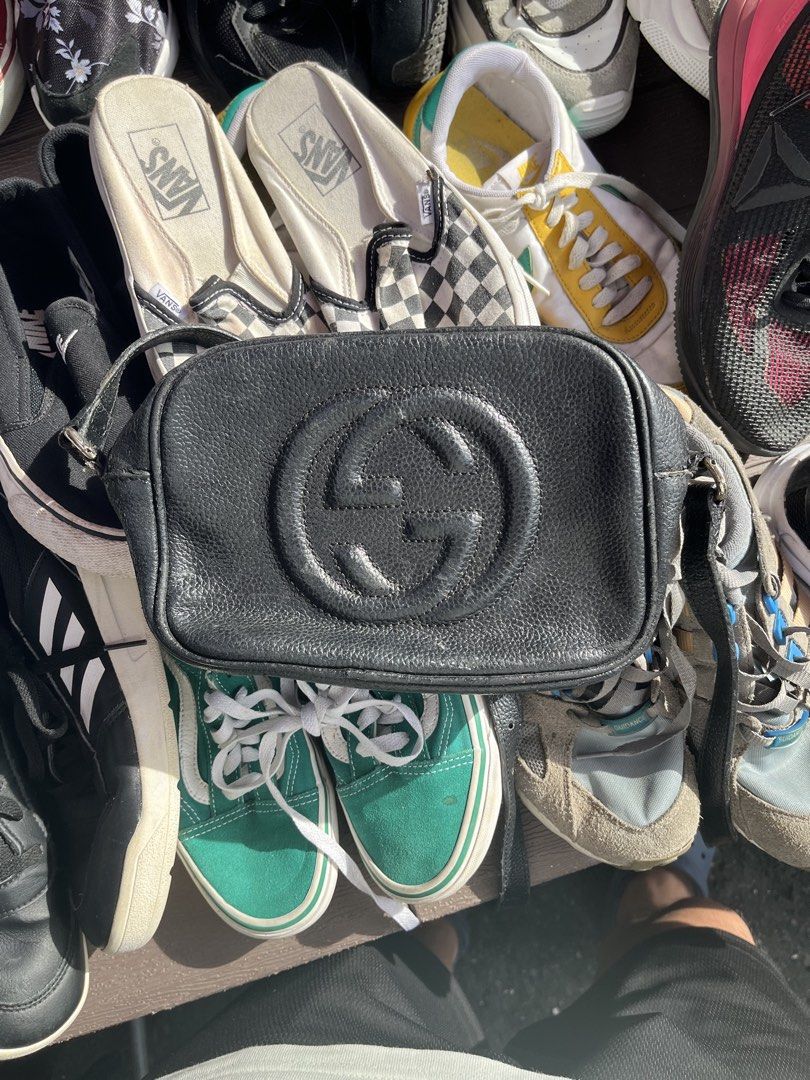 Gucci Black Leather Disco Camera Bag (Category: Luxury Bags & Wallets) located in Pilar. Submitted by fast-flip-ni-miko. (Listing ID 1468568500, Image 1). Description: - Authentic Gucci camera bag in black grained leather - Features embossed interlocking G logo on the front - Secure zip top closure with a stylish leather tassel pull - Light canvas interior equipped with small slip pockets - Adjustable shoulder strap for a customized fit - Include