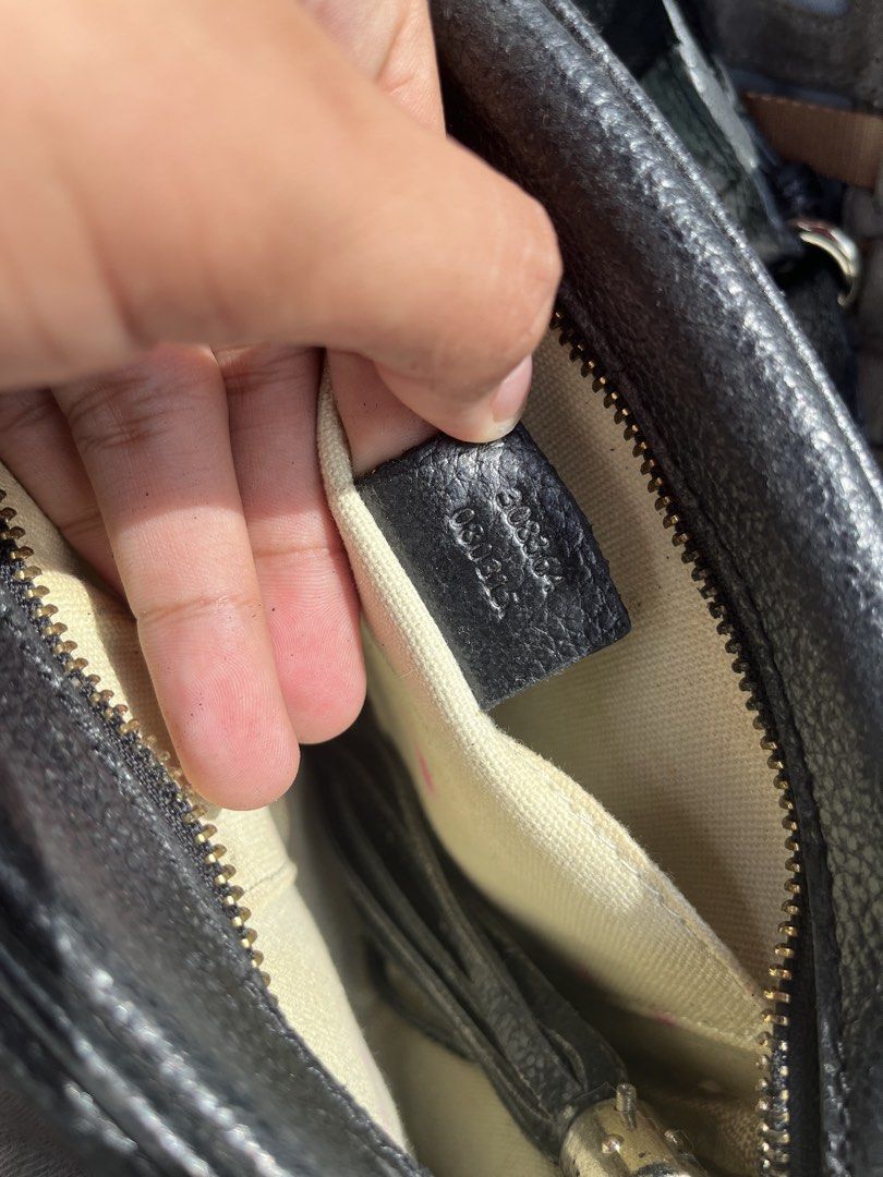 Gucci Black Leather Disco Camera Bag (Category: Luxury Bags & Wallets) located in Pilar. Submitted by fast-flip-ni-miko. (Listing ID 1468568500, Image 3). Description: - Authentic Gucci camera bag in black grained leather - Features embossed interlocking G logo on the front - Secure zip top closure with a stylish leather tassel pull - Light canvas interior equipped with small slip pockets - Adjustable shoulder strap for a customized fit - Include
