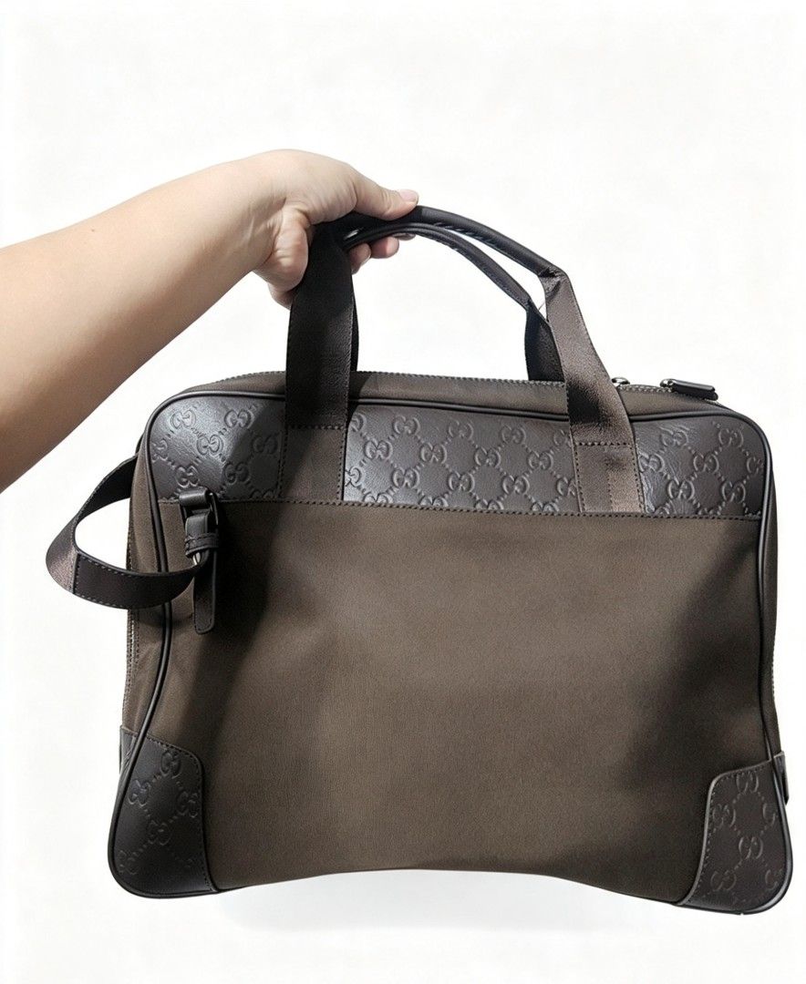 Gucci GG Imprime Briefcase Brown 162793 (Category: Luxury Bags & Wallets) located in Manila. Submitted by jialyn03310_tree (Listing ID 1468510559, Image 2). Description: brown Gucci briefcase - Material: GG Imprime canvas with leather trim - Interior: Clean blue inner lining with stamped serial number 162793 1000 on leather tag - Features: Sturdy top handles, smooth zip closure, and front metal brand plaque - Condition: Clean hardware, all zipper