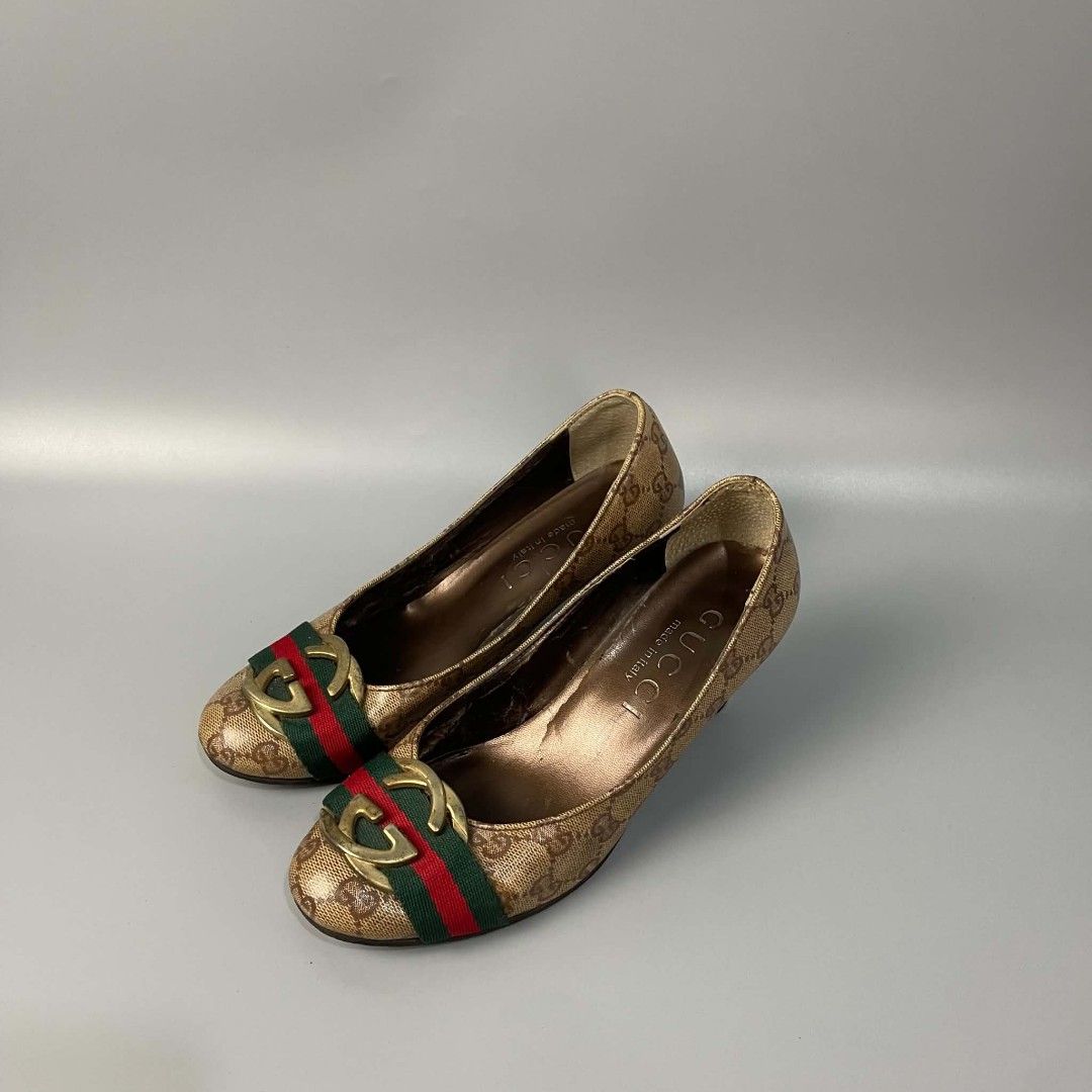 Gucci GG Monogram Web Stripe Heels (Category: Heels) located in Manila. Submitted by saintconst4ntine (Listing ID 1468500534, Image 1). Description: - Gucci pumps in classic beige GG monogram canvas - Iconic red and green web stripe with gold-tone interlocking G hardware - Elegant rounded toe and chic flared heel design - Size: 36.5 (stamped on sole) - Crafted in Italy - Condition: Moderate wear on soles and heel tips from previous use.