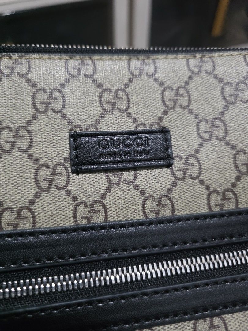 Gucci GG Supreme Messenger Bag (Category: Sling Bags) located in Lemery. Submitted by venus23 (Listing ID 1468656253, Image 2). Description: Gucci messenger bag in GG Supreme canvas. Black leather trim and front vertical zip pocket. Green and red web strap attached. Leather tag on the front with Gucci branding. Clean structured shape, daily carry size..