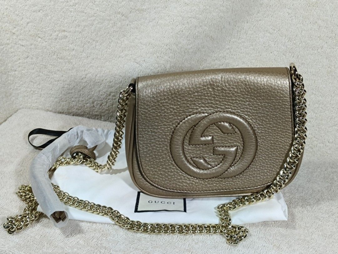 Gucci Gold Leather Shoulder Bag with Interlocking G (Category: Luxury Bags & Wallets) located in Cavite. Submitted by navias (Listing ID 1468582484, Image 1). Description: negotiable if we both agree - Brand: Gucci - Color: Metallic Gold - Material: Premium Leather - Features: Large interlocking G logo on front flap, gold-tone chain strap - Interior: Fabric lining with leather brand tag - Condition: Brand new with hardware still wrapped in protec