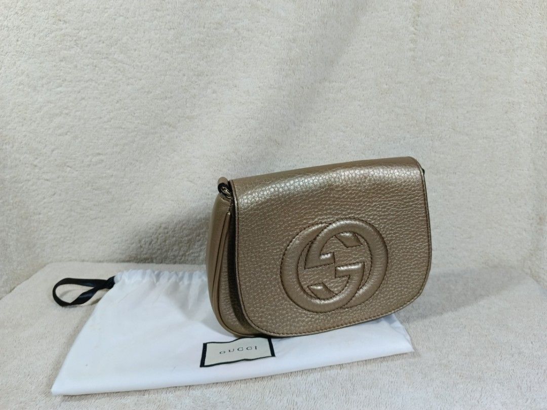 Gucci Gold Leather Shoulder Bag with Interlocking G (Category: Luxury Bags & Wallets) located in Cavite. Submitted by navias (Listing ID 1468582484, Image 2). Description: negotiable if we both agree - Brand: Gucci - Color: Metallic Gold - Material: Premium Leather - Features: Large interlocking G logo on front flap, gold-tone chain strap - Interior: Fabric lining with leather brand tag - Condition: Brand new with hardware still wrapped in protec