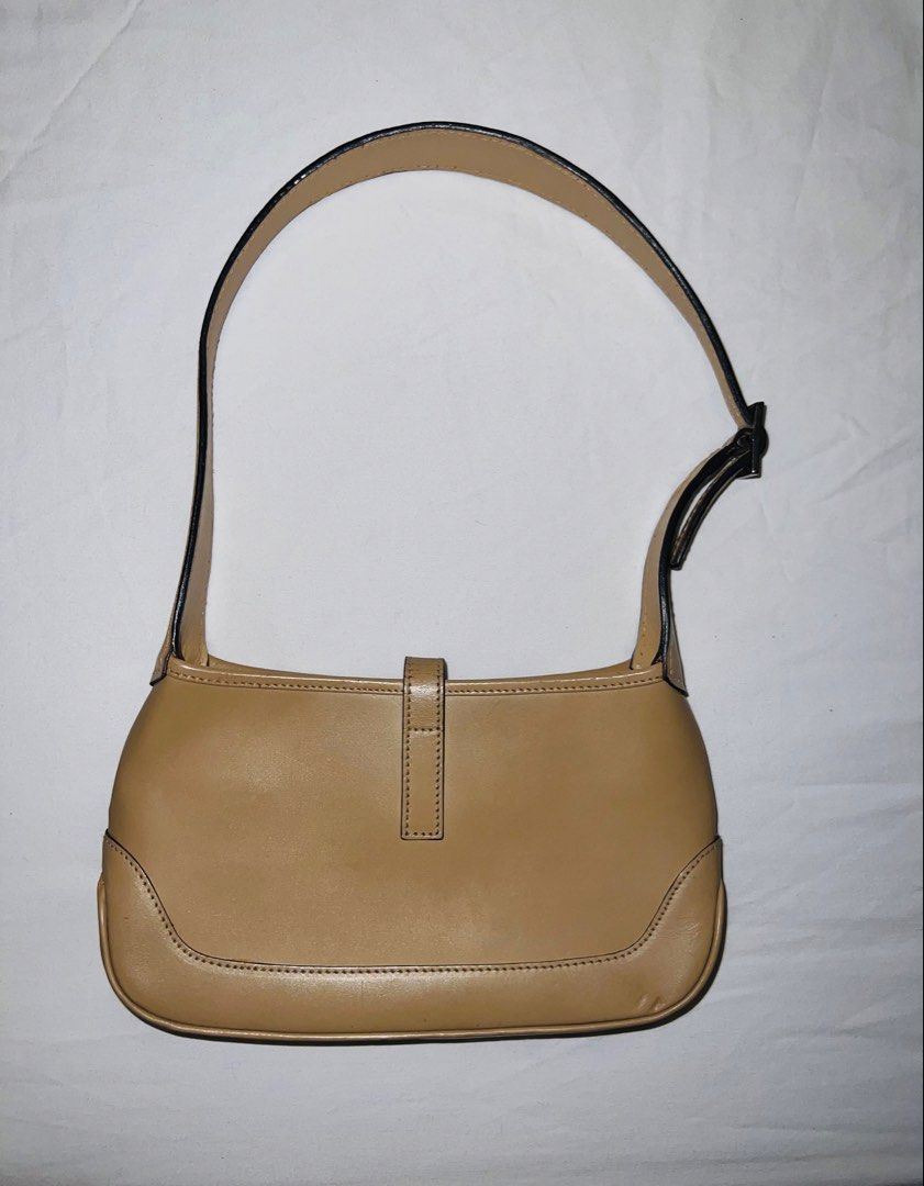Gucci Mini Jackie Tom Ford Era (Category: Luxury Bags & Wallets) located in Manila. Submitted by mariekondodeclutterstoday (Listing ID 1468683025, Image 2). Description: Authentic Gucci beige leather shoulder bag featuring the classic piston closure, adjustable strap, and clean interior. Well-maintained with minimal wear on the leather and clean hardware..