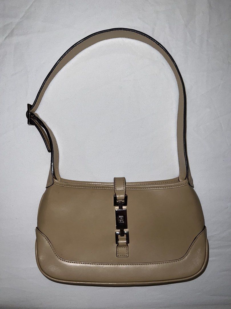 Gucci Mini Jackie Tom Ford Era (Category: Luxury Bags & Wallets) located in Manila. Submitted by mariekondodeclutterstoday (Listing ID 1468683025, Image 1). Description: Authentic Gucci beige leather shoulder bag featuring the classic piston closure, adjustable strap, and clean interior. Well-maintained with minimal wear on the leather and clean hardware..
