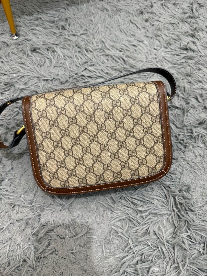 Gucci Supreme Horsebit Mini (Category: Luxury Bags & Wallets) located in Quezon City. Submitted by ashhaul (Listing ID 1468571241, Image 2). Description: - Gucci shoulder bag - Crafted in iconic GG Supreme canvas - Brown leather trim with contrast white stitching - Gold-tone hardware featuring signature horsebit detail - Secure flap closure - Brown fabric-lined interior with multiple compartments and a zippered pocket - Includes a removable brown