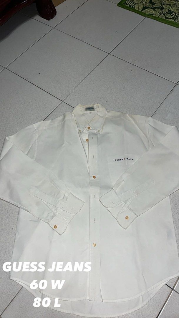 Guess Jeans White Long Sleeve Button Down Shirt (Category: Longsleeves) located in Manila. Submitted by wildstone_56314f (Listing ID 1468672523, Image 1). Description: only issue is yellow stains but washable price is negotiable.