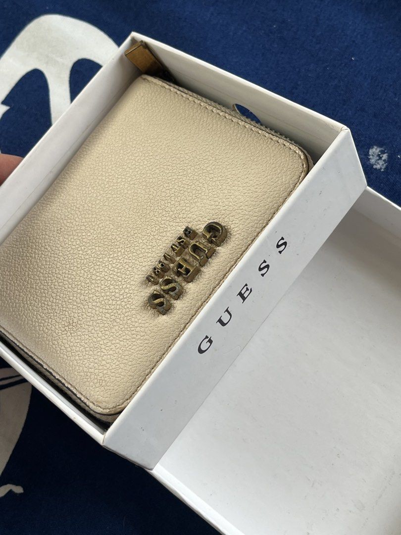 Guess Laurel SLG Small Zip Around Wallet Cognac (Category: Wallets & Card holders) located in Malolos. Submitted by magnoannchrstn (Listing ID 1468515517, Image 1). Description: - Brand: Guess - Style: Laurel SLG Small Zip-Around Wallet - Color: Rich Cognac - Material: Premium textured pebble leather with antique bronze hardware and prominent logo lettering - Interior Features: Card slots, slip pocket, and convenient ID window - Condition: Well u