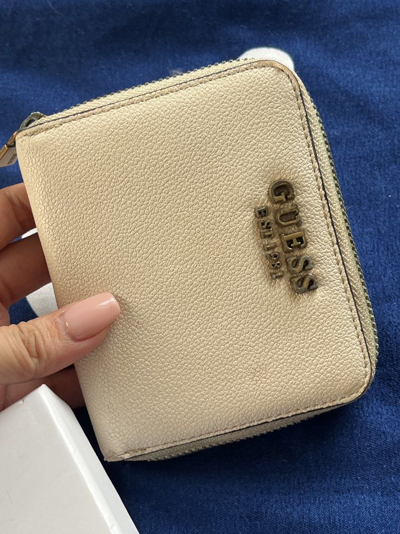 Guess Laurel SLG Small Zip Around Wallet Cognac (Category: Wallets & Card holders) located in Malolos. Submitted by magnoannchrstn (Listing ID 1468515517, Image 2). Description: - Brand: Guess - Style: Laurel SLG Small Zip-Around Wallet - Color: Rich Cognac - Material: Premium textured pebble leather with antique bronze hardware and prominent logo lettering - Interior Features: Card slots, slip pocket, and convenient ID window - Condition: Well u
