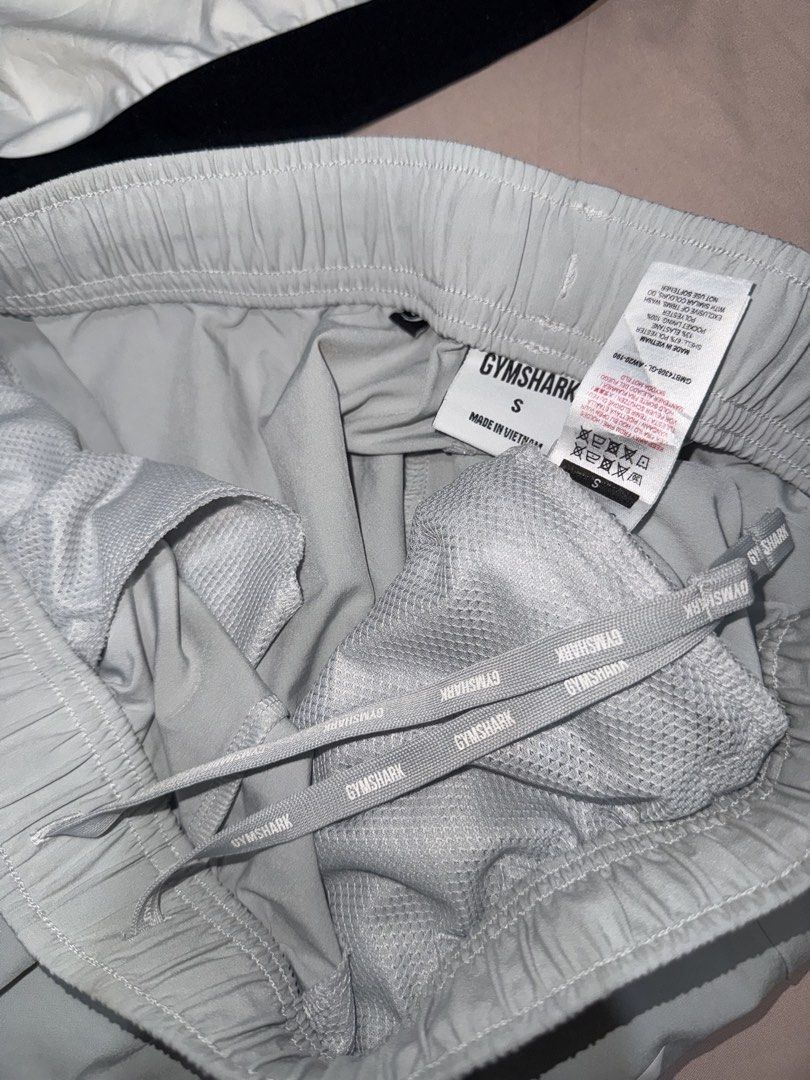 Gymshark Grey Training Shorts 🩶 (Category: Activewear) located in Pasay City. Submitted by bellita_05 (Listing ID 1468692649, Image 3). Description: • Brand: Gymshark • Colour: Light grey • Size: Small (S) • Style: Athletic / training shorts • Elastic waistband with drawstring • Side pockets • Lightweight fabric with mesh lining • Made in Vietnam Perfect for gym workouts, running and everyday activewear..