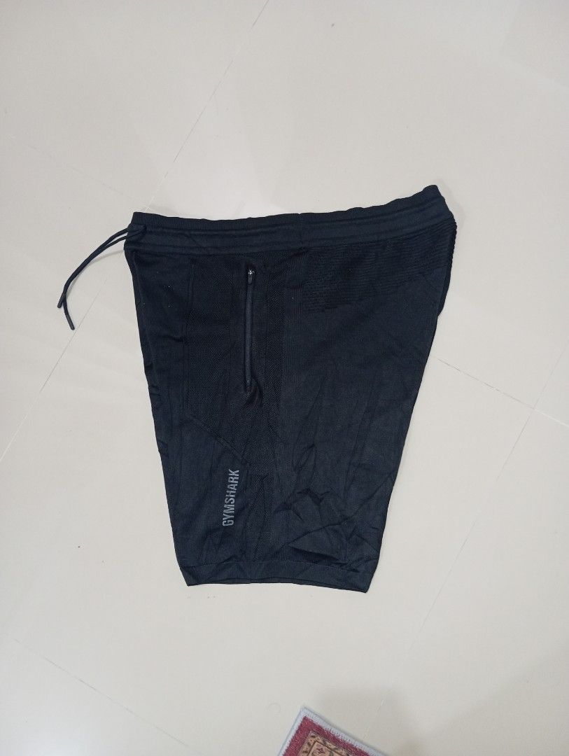 Gymshark True knit Short (Category: Shorts) located in Guihulngan. Submitted by jaylordfra13193 (Listing ID 1468686772, Image 2). Description: - Brand: Gymshark - Color: Black - Size: L - Material: 100% polyester (Made in Sri Lanka) - Features: Zippered pockets on both sides, adjustable drawstring waistband - Style/Season: GMSH4418-BK / AW20-423 - Condition/Use: Lightweight fabric, ideal for gym workouts and running Free Size length 21 leg Openin
