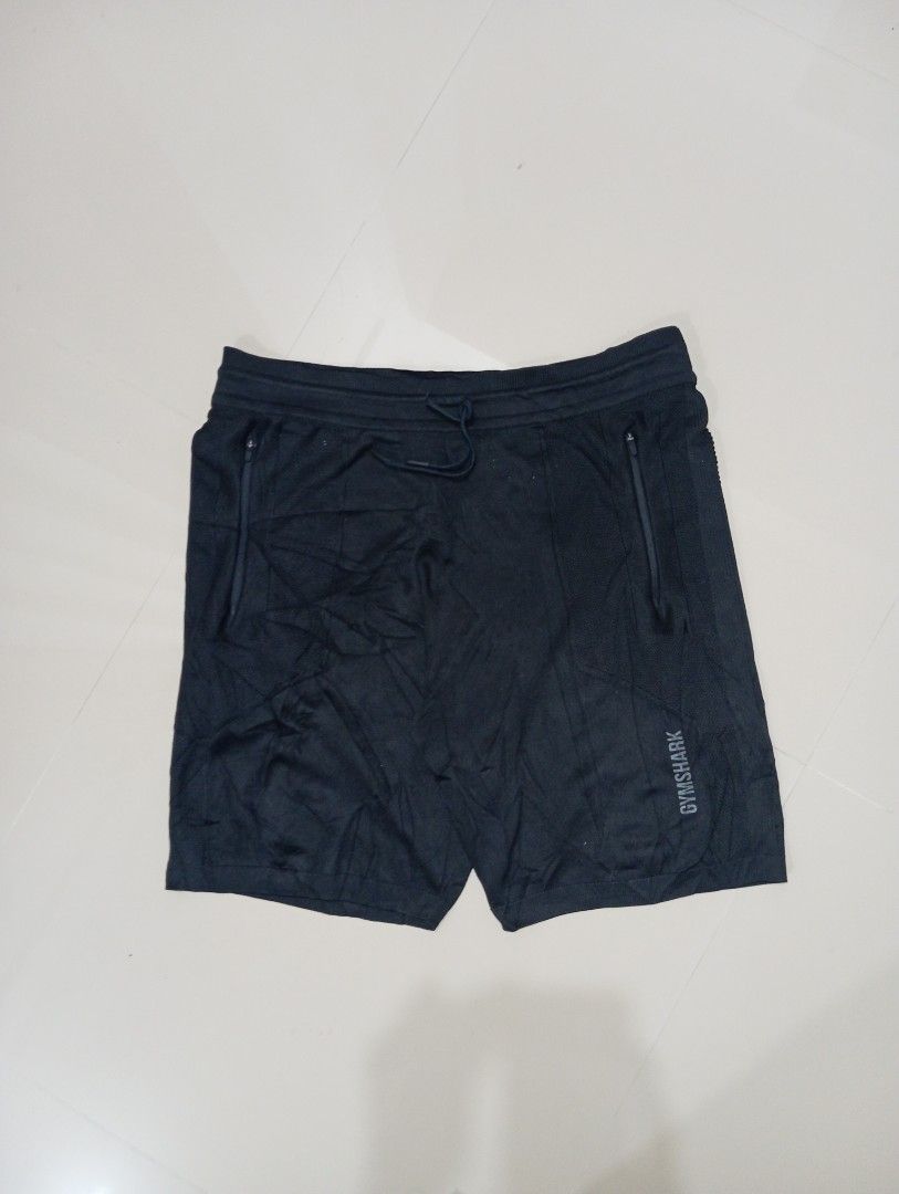 Gymshark True knit Short (Category: Shorts) located in Guihulngan. Submitted by jaylordfra13193 (Listing ID 1468686772, Image 1). Description: - Brand: Gymshark - Color: Black - Size: L - Material: 100% polyester (Made in Sri Lanka) - Features: Zippered pockets on both sides, adjustable drawstring waistband - Style/Season: GMSH4418-BK / AW20-423 - Condition/Use: Lightweight fabric, ideal for gym workouts and running Free Size length 21 leg Openin