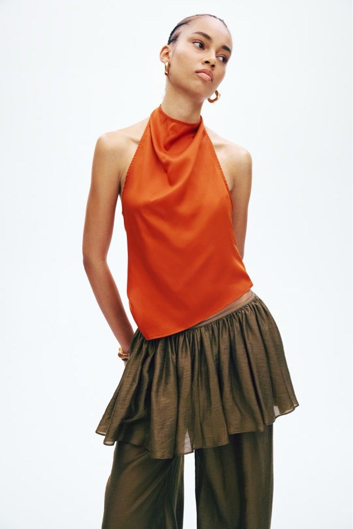 Halter Neck Satin Top (Rust Orange) (Category: Sleeveless) located in Pasig City. Submitted by thriftventure_mnl (Listing ID 1468511795, Image 1). Description: - authentic! from h&m moa - bnew w tag 🧡🌅 - srp is 799 - rfs not my size - dont lowball too much given that its bnew. thank you :) PAYMENT VIA: BDO Gcash COD (for manila & pasig area) DELIVERY VIA: Grabdelivery Lalamove J&T Express.