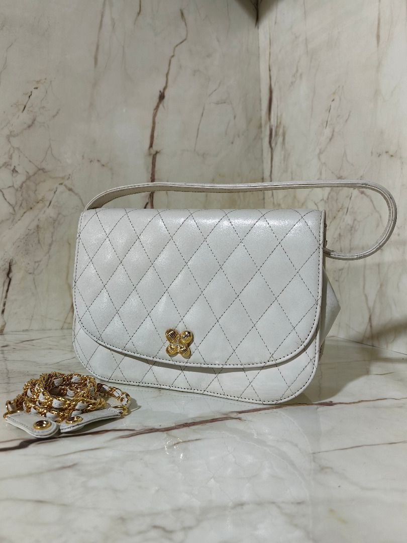Hanae Mori White Quilted Handbag with Chain Strap (Category: Shoulder Bags) located in Tarlac. Submitted by jeremiah.curator.2026 (Listing ID 1468561048, Image 1). Description: - Brand: Hanae Mori - Color: Classic white with elegant quilted pattern - Hardware: Gold-tone hardware with secure front clasp closure - Straps: Includes a standard top handle and a detachable gold chain strap - Interior: Features official Hanae Mori brand plaque - Conditi