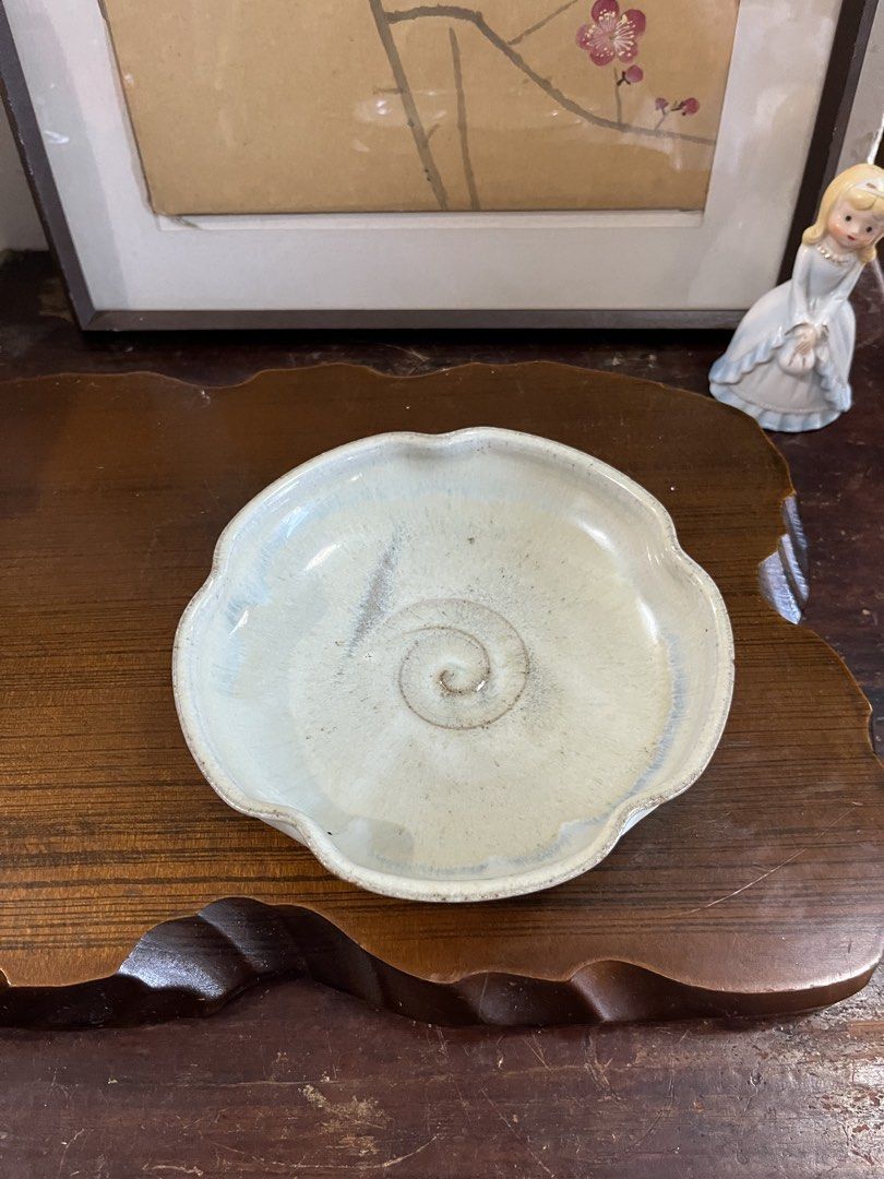 Handmade Ceramic Dish Catchall Scalloped Edge (Category: Dinnerware & Cutlery) located in Taguig. Submitted by minmin_parker (Listing ID 1468537045, Image 3). Description: - Type: Handmade ceramic dish - Design: Scalloped edges with a unique spiral center - Color/Finish: Light beige and blue glaze - Features: Sturdy build with a nice weight and clean interior - Uses: Great for organizing keys, trinkets, or small jewelry pieces.