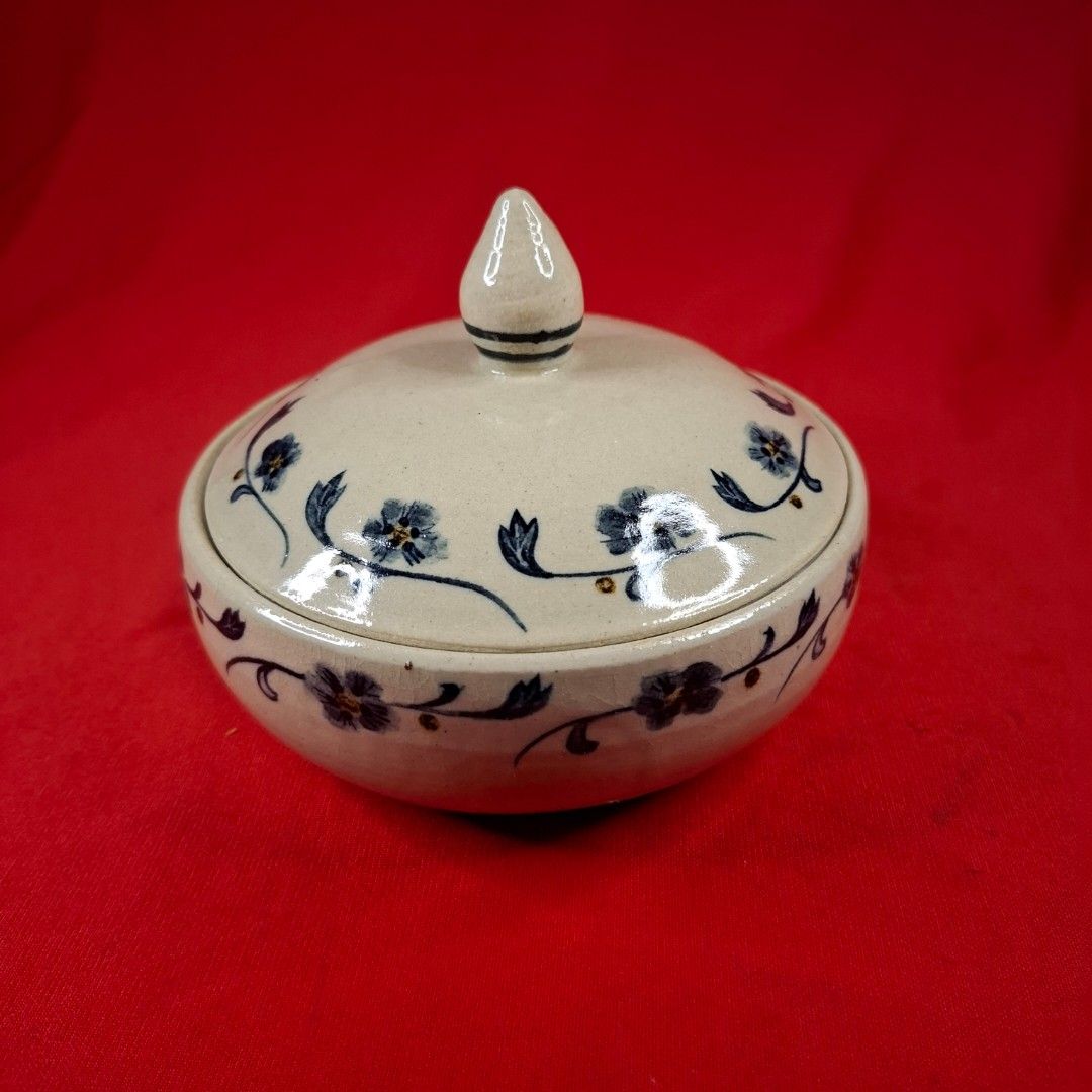 Handmade Ceramic Sugar Bowl with Lid Blue Floral Pattern (Category: Vases & Decorative Bowls) located in Mandaluyong City. Submitted by edward123_andren (Listing ID 1468708102, Image 1). Description: - Handmade stoneware ceramic pot - Delicate blue floral design on off-white glaze - Includes matching fitted lid with pointed finial knob - Features maker's stamp on the base - Opening measures approx. 11 cm across - Smooth interior glaze, perfect fo