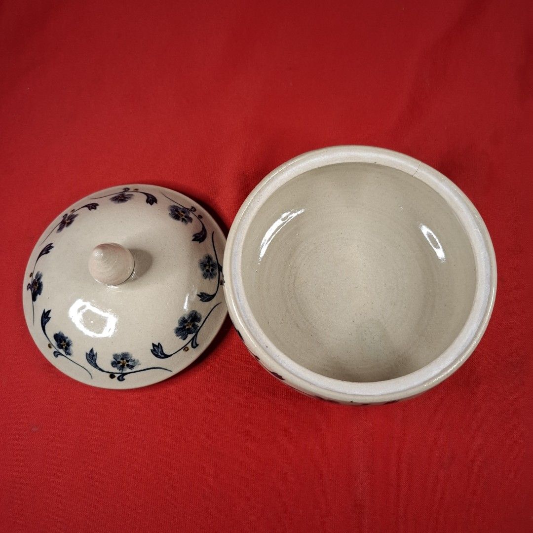 Handmade Ceramic Sugar Bowl with Lid Blue Floral Pattern (Category: Vases & Decorative Bowls) located in Mandaluyong City. Submitted by edward123_andren (Listing ID 1468708102, Image 2). Description: - Handmade stoneware ceramic pot - Delicate blue floral design on off-white glaze - Includes matching fitted lid with pointed finial knob - Features maker's stamp on the base - Opening measures approx. 11 cm across - Smooth interior glaze, perfect fo