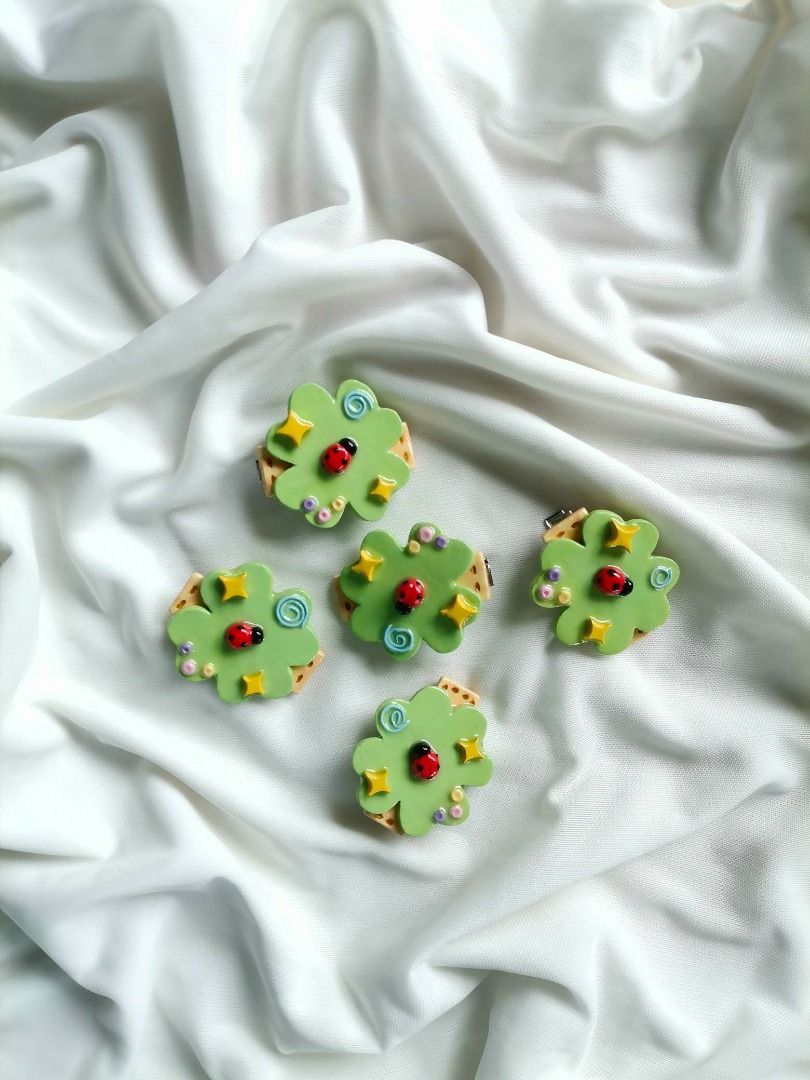 Handmade Clay Hair Clips Set Cute Designs (Category: Hair Accessories) located in Caloocan City. Submitted by mauve.trouvaille.clay (Listing ID 1468594014, Image 1). Description: - Handcrafted polymer clay hair clips with a shiny glossy finish - Cute designs: ladybugs on clover, happy strawberries, pastel butterflies, and mini apples - Fitted with secure metal alligator clips on the back - Fun and colorful accessories to elevate your daily OOTD -