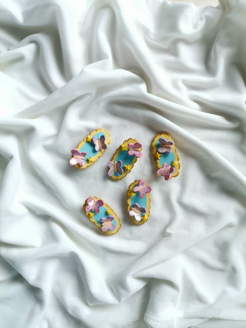Handmade Clay Hair Clips Set Cute Designs (Category: Hair Accessories) located in Caloocan City. Submitted by mauve.trouvaille.clay (Listing ID 1468594014, Image 3). Description: - Handcrafted polymer clay hair clips with a shiny glossy finish - Cute designs: ladybugs on clover, happy strawberries, pastel butterflies, and mini apples - Fitted with secure metal alligator clips on the back - Fun and colorful accessories to elevate your daily OOTD -