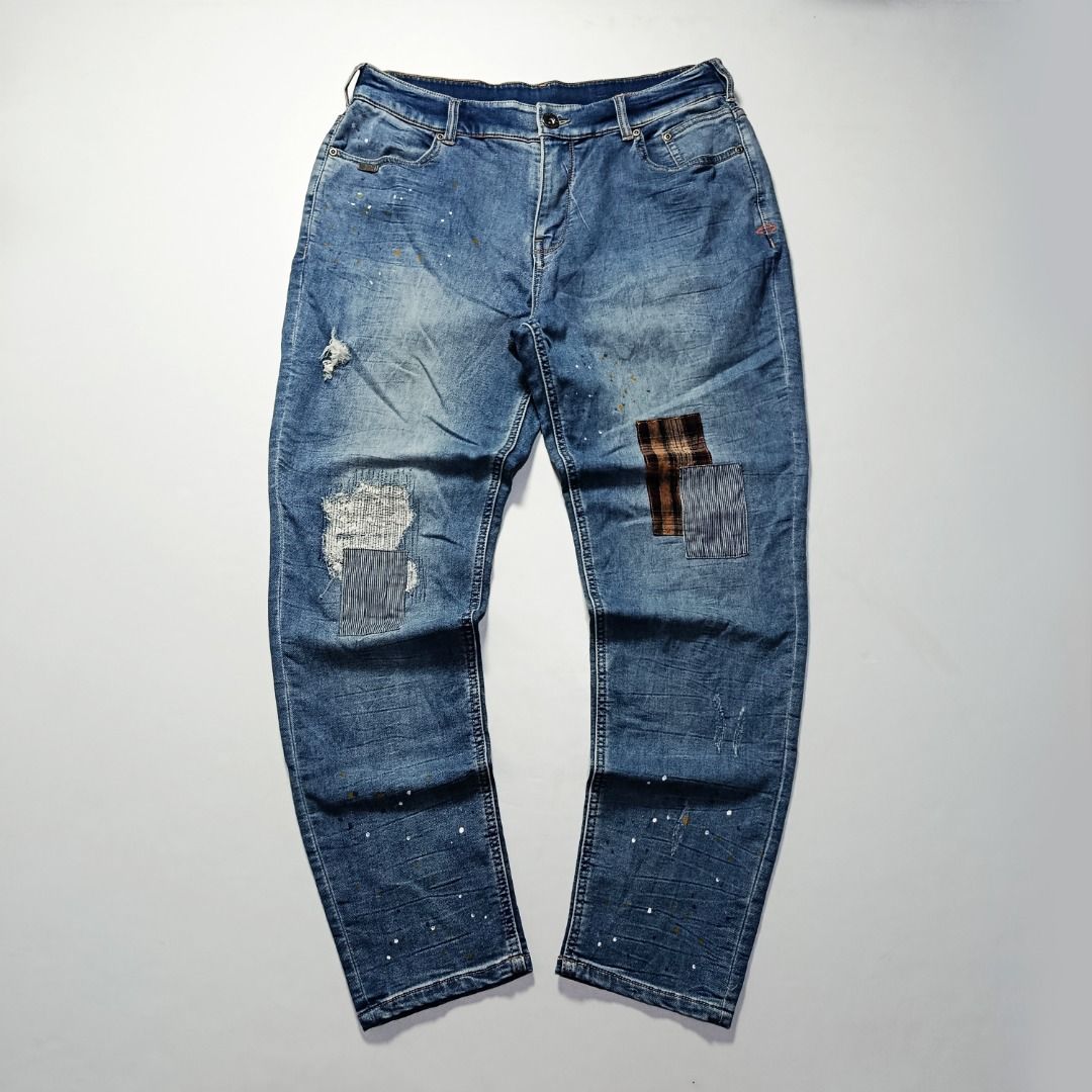 Harley-Davidson Patchwork Paint-Splatter Jeans (Category: Jeans) located in Taytay. Submitted by hoodgrail.vtg (Listing ID 1468641201, Image 1). Description: • Excellent condition - Lightly used • Distressed knee details, contrasting patchwork repairs, and multicolor paint splatters • Size on tag: XL — estimated best fit W34 • Measurements: 17 x 41 in • Leg opening: 6.5 in • Color rate: 9/10 • Issue: None.