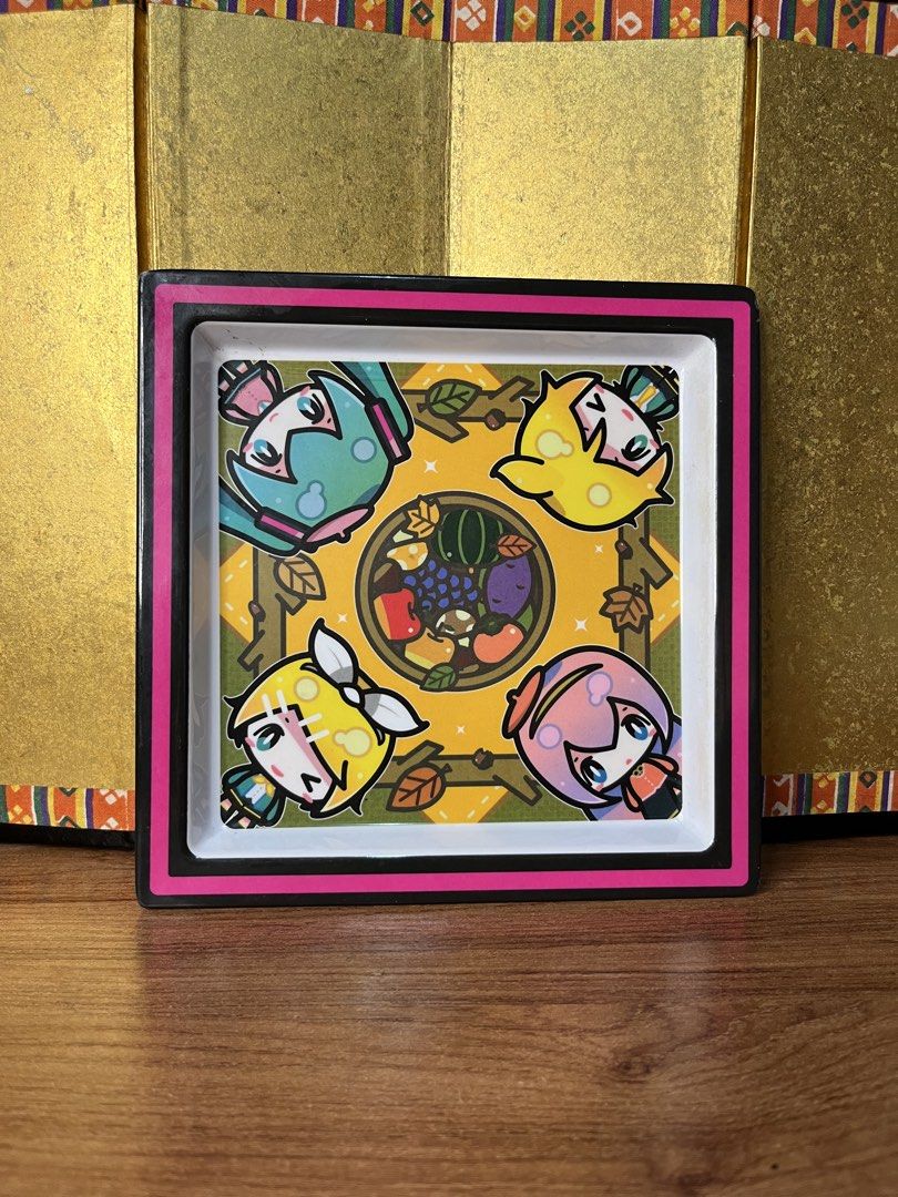 Original Hatsune Miku melamine square plate (Category: Art & Prints) located in Gapan. Submitted by lunashop14 (Listing ID 1468692571, Image 1). Description: - Official Crypton Future Media merchandise illustrated by MISONI - Features cute chibis of Hatsune Miku, Kagamine Rin, Kagamine Len, and Megurine Luka - Charming autumn fruits design with vibrant, high-quality printing - Sturdy melamine square tray with clean white back and official manufac