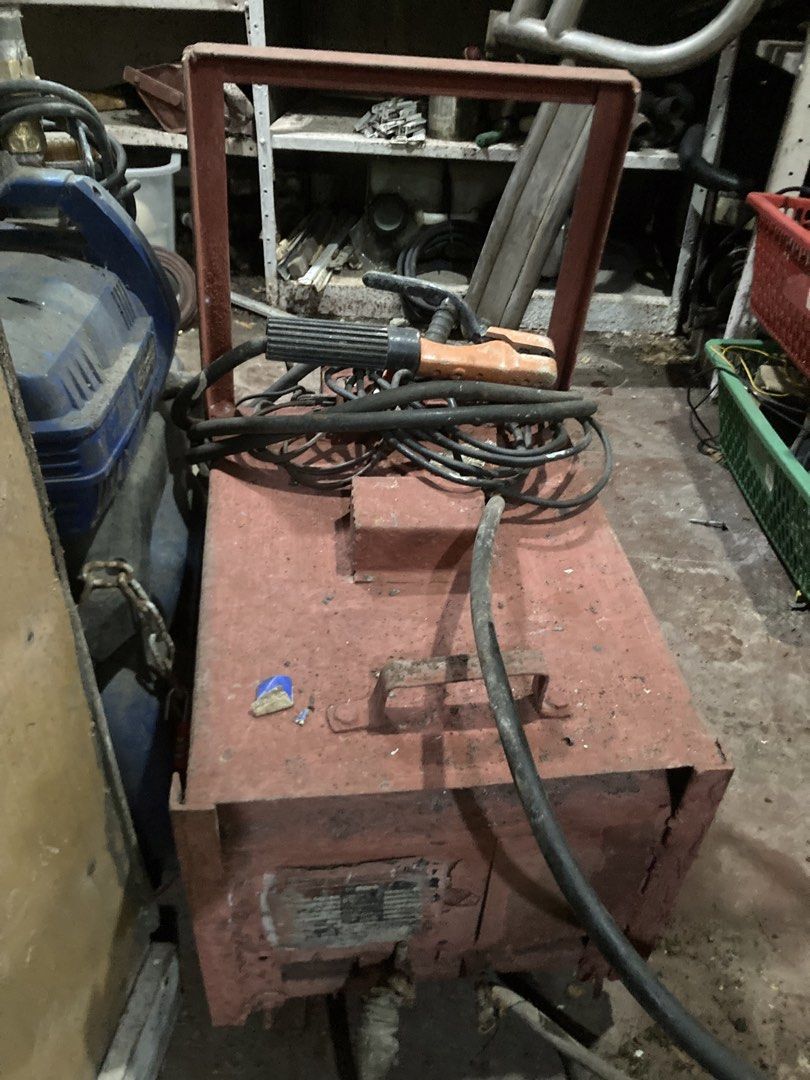 Heavy-Duty Arc Welding Machine with Cables and Holder (Category: Construction Tools & Equipment) located in Manila. Submitted by roberto.enriquez (Listing ID 1468690424, Image 3). Description: - Industrial arc welding machine in red metal housing - Includes thick power cables and electrode holder - Built-in metal frame handle for easy workshop mobility - Solid and heavy-duty build, perfect for garage and fabrication work - Fully intact wiring and