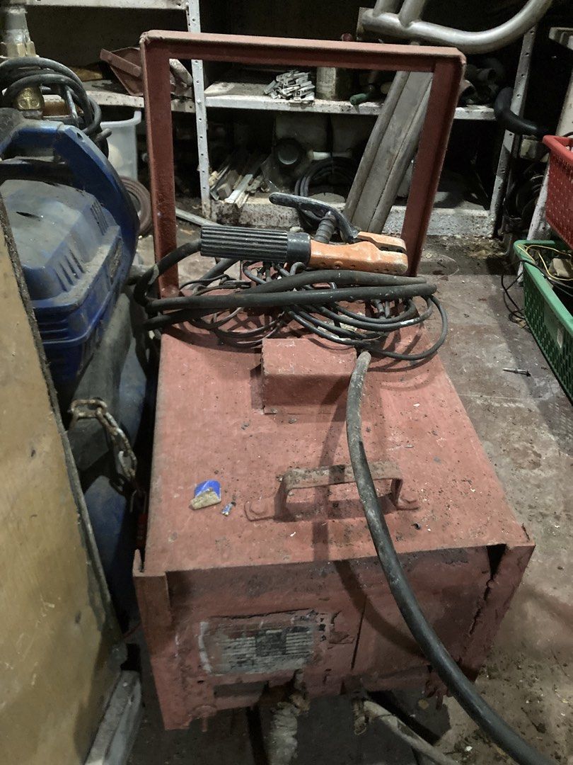 Heavy-Duty Arc Welding Machine with Cables and Holder (Category: Construction Tools & Equipment) located in Manila. Submitted by roberto.enriquez (Listing ID 1468690424, Image 2). Description: - Industrial arc welding machine in red metal housing - Includes thick power cables and electrode holder - Built-in metal frame handle for easy workshop mobility - Solid and heavy-duty build, perfect for garage and fabrication work - Fully intact wiring and