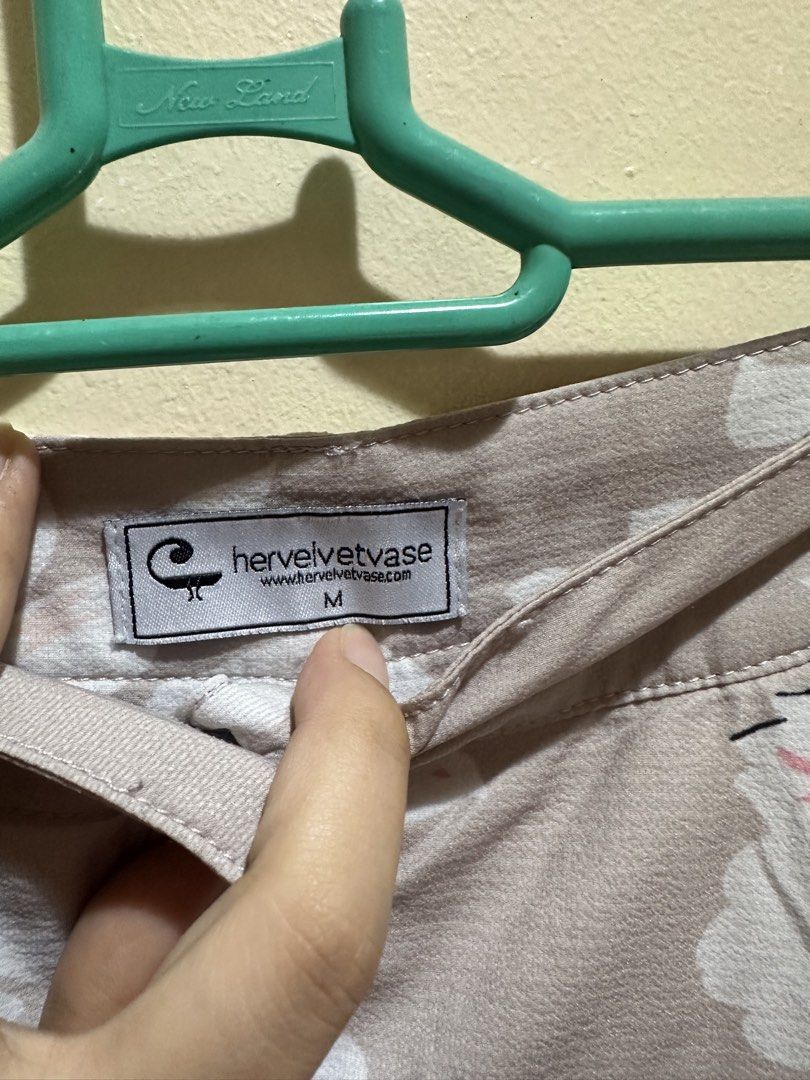 Hervelvetvase Floral Maxi Skirt (Category: Skirts) located in Baliuag. Submitted by ritzkisses (Listing ID 1468520413, Image 3). Description: - Brand: Hervelvetvase - Size: M - Color/Design: Soft beige/grey base with all-over white and pink floral print - Details: Functional button-down front with matching buttons, pleated waist, and built-in side pockets - With inner lining - Styling: Easy to pair with basic tops or blouses.