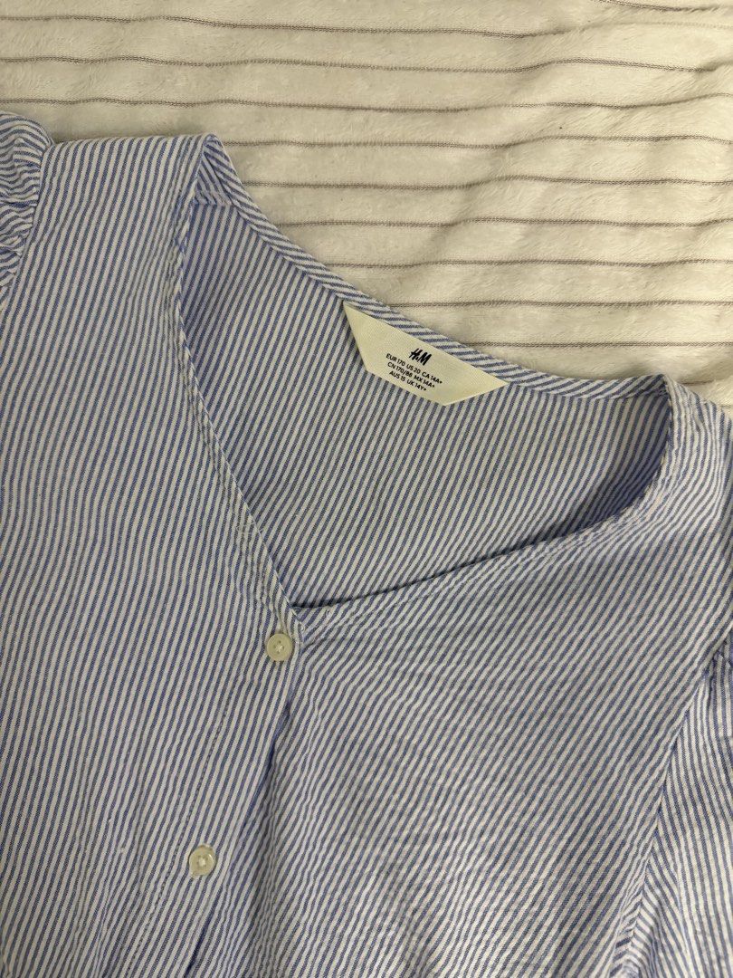 H&M Blue and White Striped Blouse Size 14A+ (Category: Blouses) located in Rizal. Submitted by kianapreloves (Listing ID 1468593485, Image 2). Description: - Brand: H&M - Design: Blue and white stripes with a flattering peplum silhouette and gathered waist - Details: Short puff sleeves, V-neckline, and functional front buttons - Material: Lightweight and breathable fabric - Styling: Easy to match with jeans, shorts, or skirts for everyday wear - 