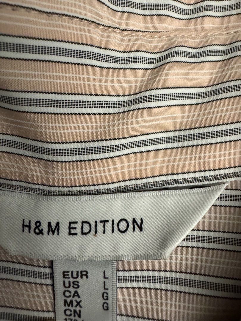 H&M Edition Striped Long Sleeve Button-Down Shirt (Category: Longsleeves) located in Taguig. Submitted by sqaumejada (Listing ID 1468526880, Image 3). Description: - Brand: H&M Edition - Design: Classic pink, white, and navy stripe pattern - Size: L (Universal EUR, US, CA, MX, CN sizing) - Features: Long sleeves with wide cuffs, standard collar, button front closure - Style: Clean look, easy to dress up or down for casual or smart occasions.